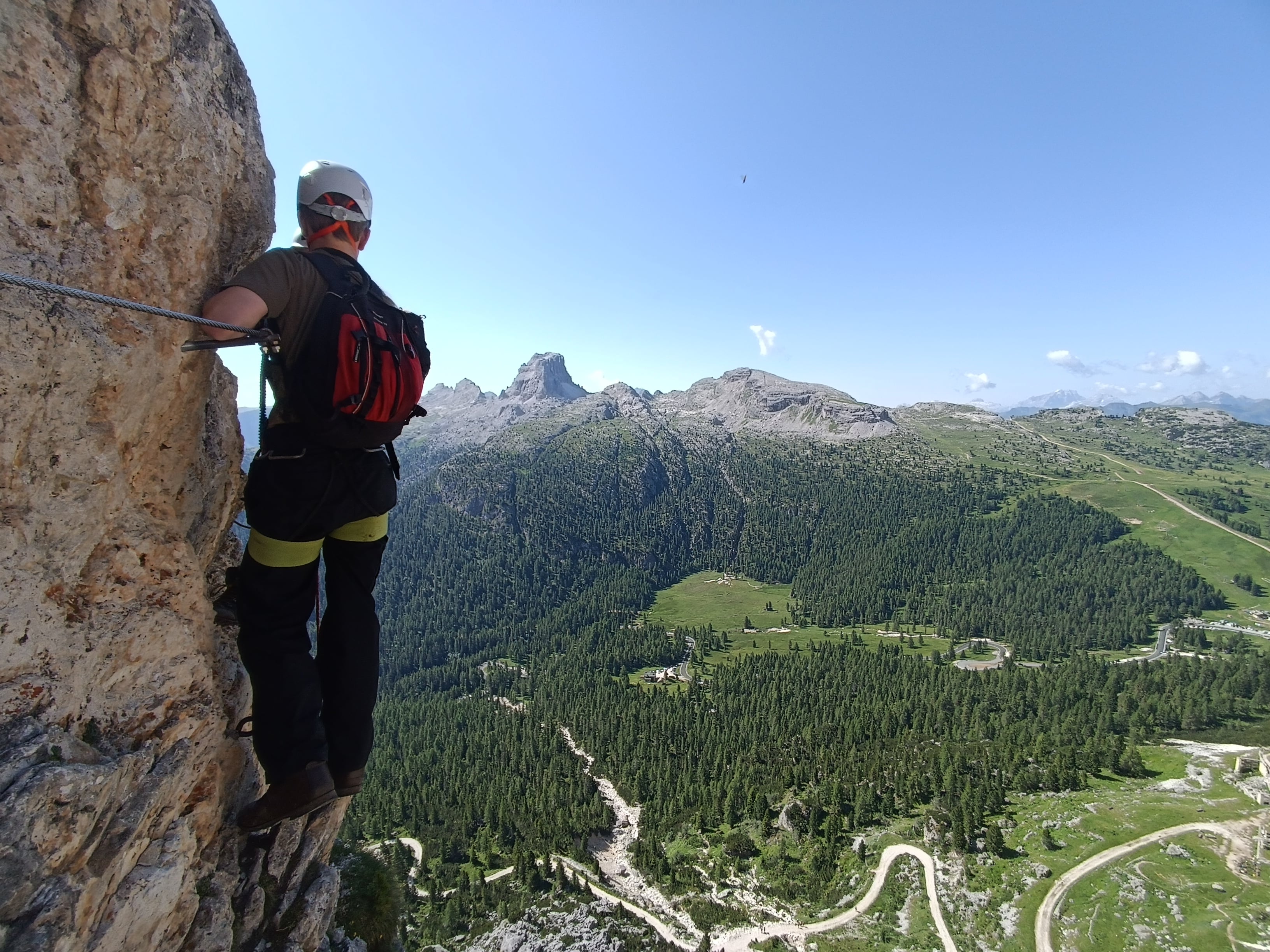 Young person rock climbing up a mountain for a Ulysses expedition