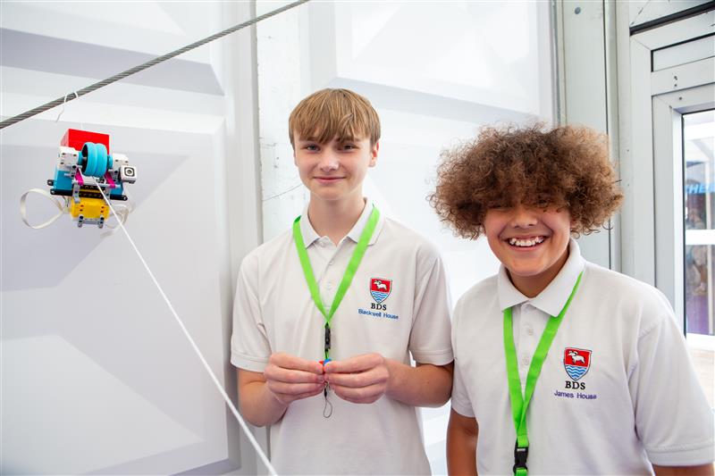 Boys taking part in Road to RIAT Blast Off competition with Lego robot for RIAT24