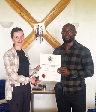 Maria Johnston receiving award