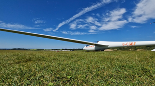 View of a glider in a field