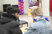 Further education maths challenge students conferring.