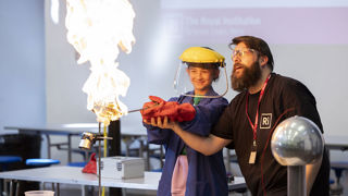 Girl taking part in an experiment for Engineering UK's Hornsey girls Big Bang competition for RIAT24