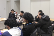 Further education maths challenge students sitting.