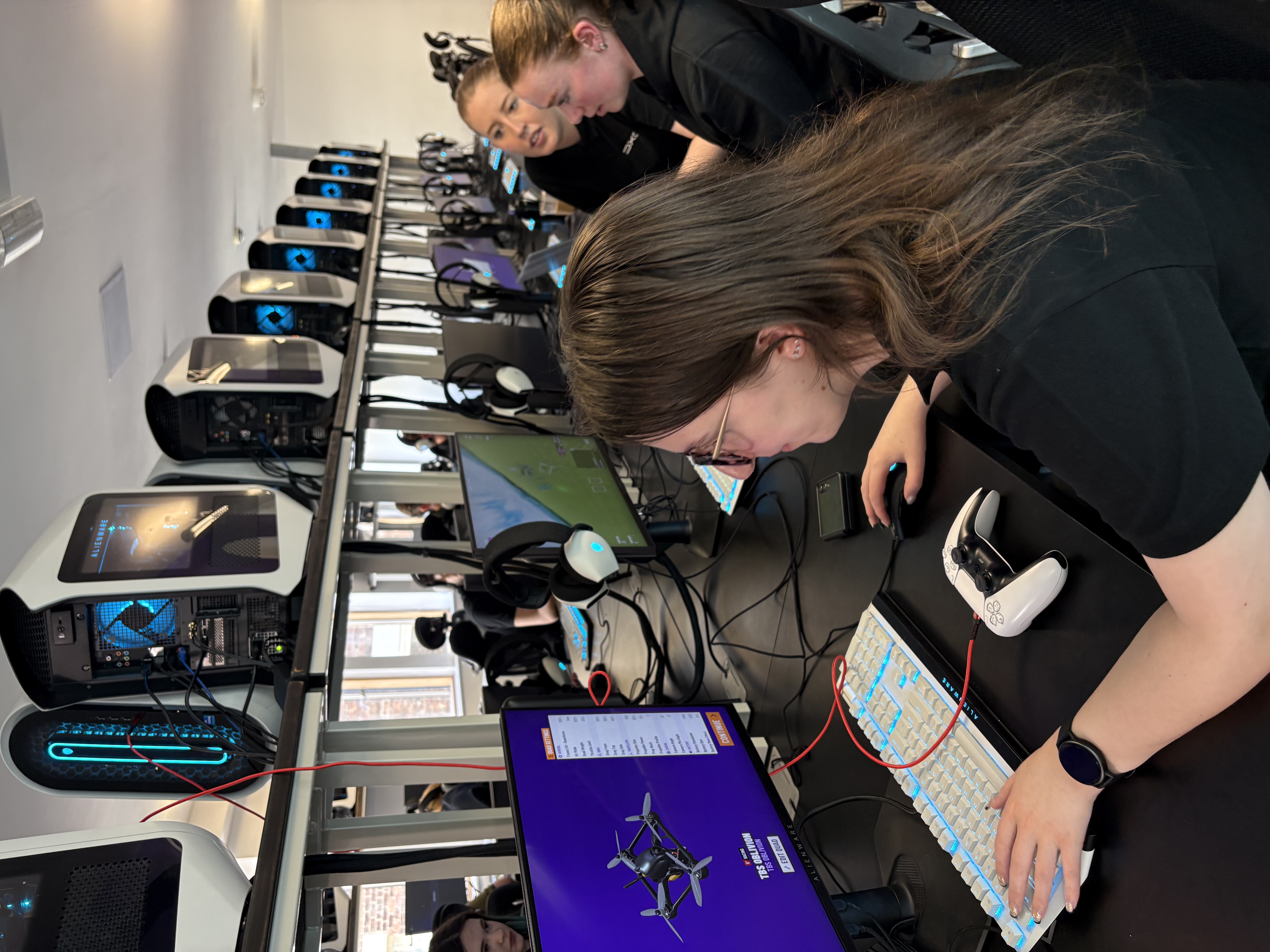 Race to RIAT screens in row with three young women.