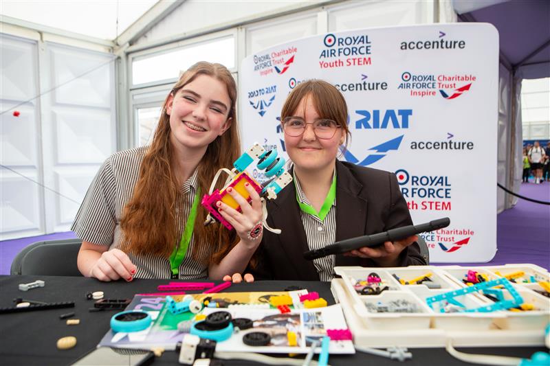 Girls building models for the Road to RIAT Blast Off competition