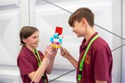 Pupils taking part in a Road to RIAT Blast Off activity with a model on a pulley